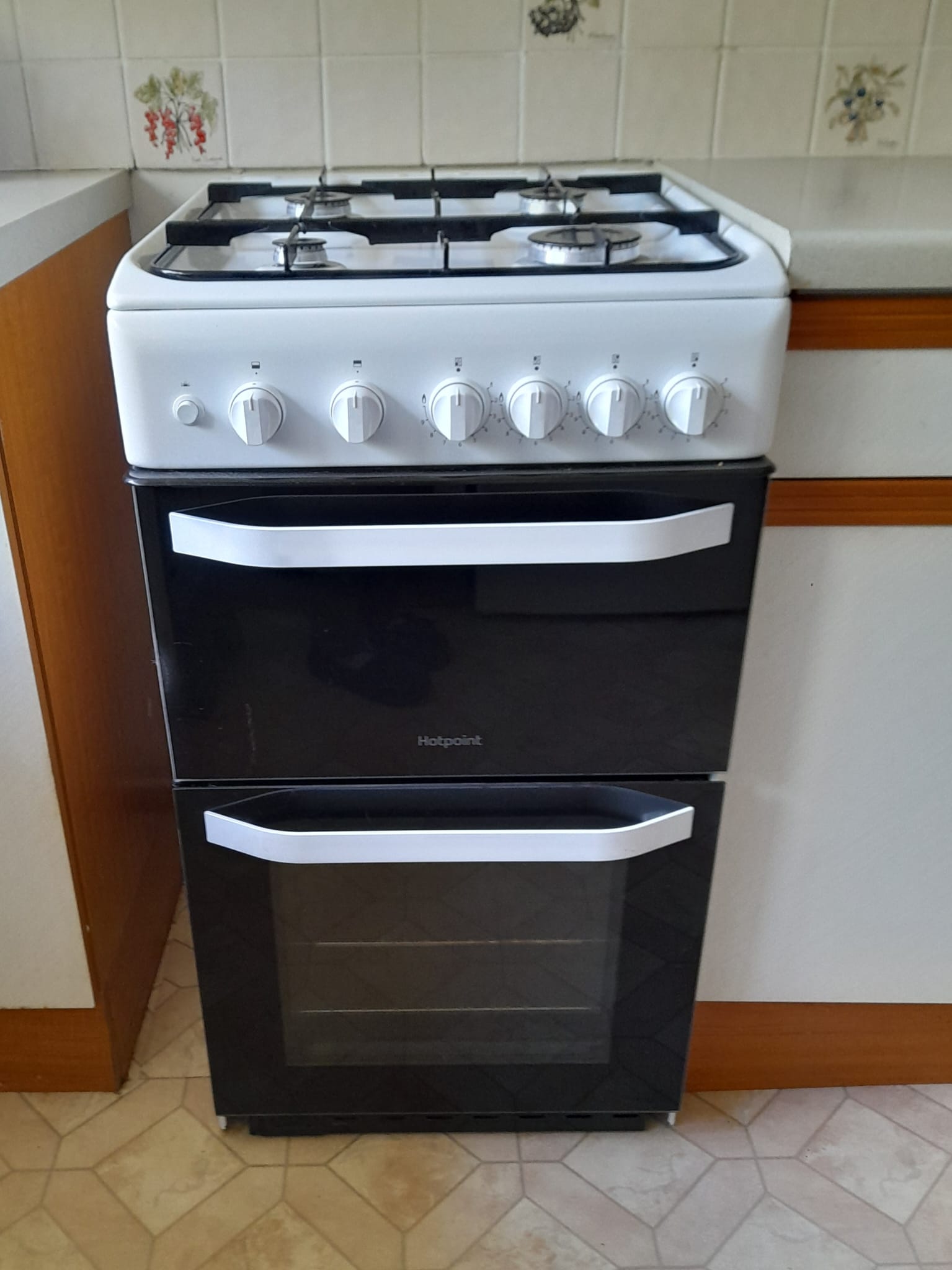 A freestanding Hotpoint gas cooker awaiting collection for recycling